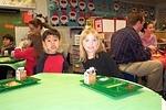 Rebecca and her friend, Giovanni, having lunch at a Christmas Party at school.