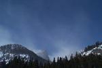 Hallet and Flattop peeking out of the clouds.