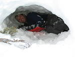 Michael working on the snow cave near the summit.
