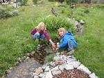 Hannah and Rebacca entertain themselves in the creek where the runners go by.