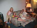 The girls vegging out with my Dad watching TV