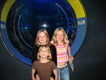 The girls pose in front of the portal