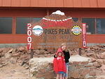 Eliz and Rebecca the Summit sign by the gift shop