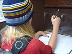 Elizabeth signing into the register at the Trailhead.