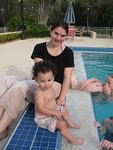 Mary and Benjamin splash at poolside
