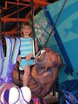 Rebecca rides the Merry go Round