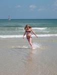 Elizabeth splashes as she enters the cold ocean at Daytona Beach